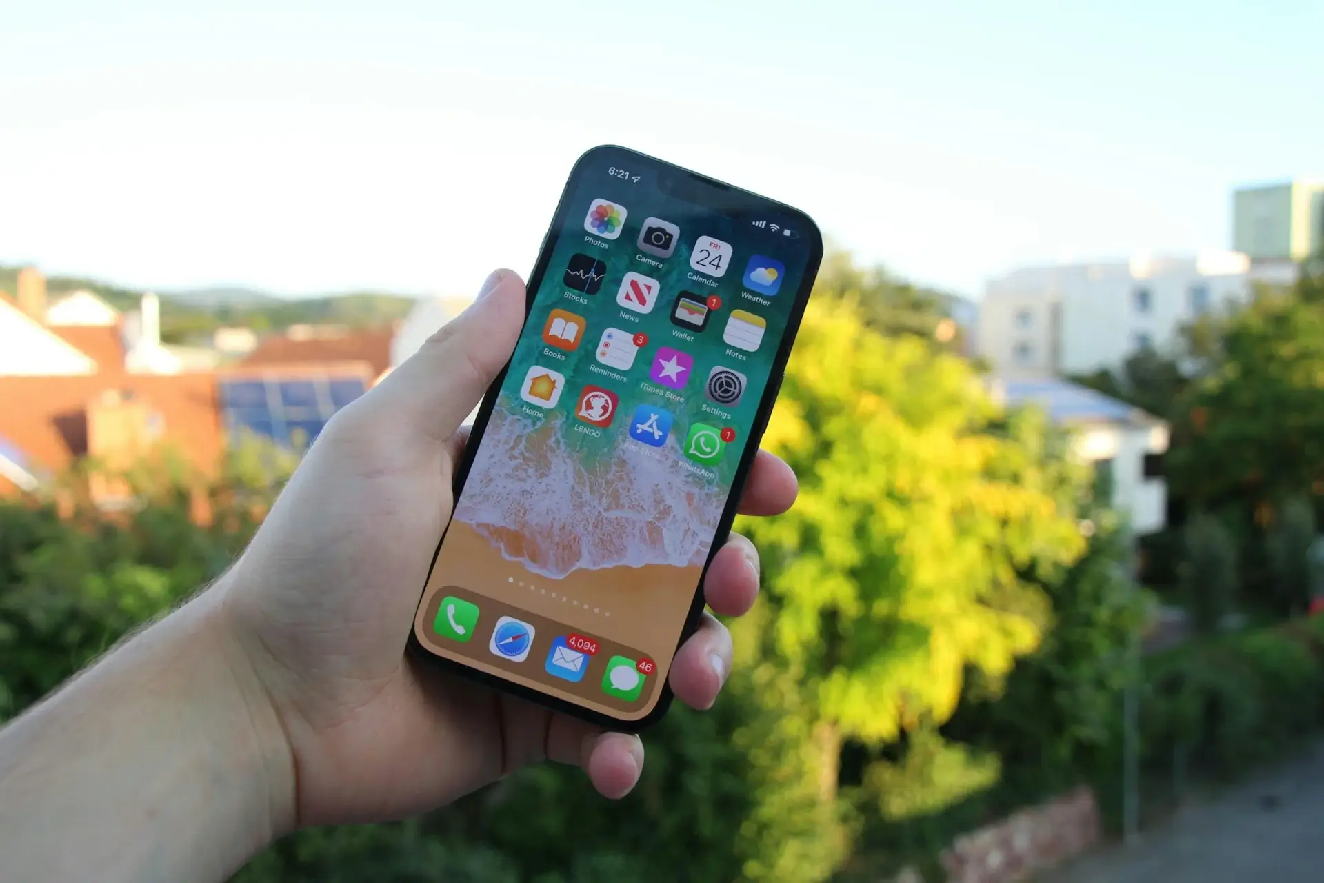 Man holding iphone on sunny day