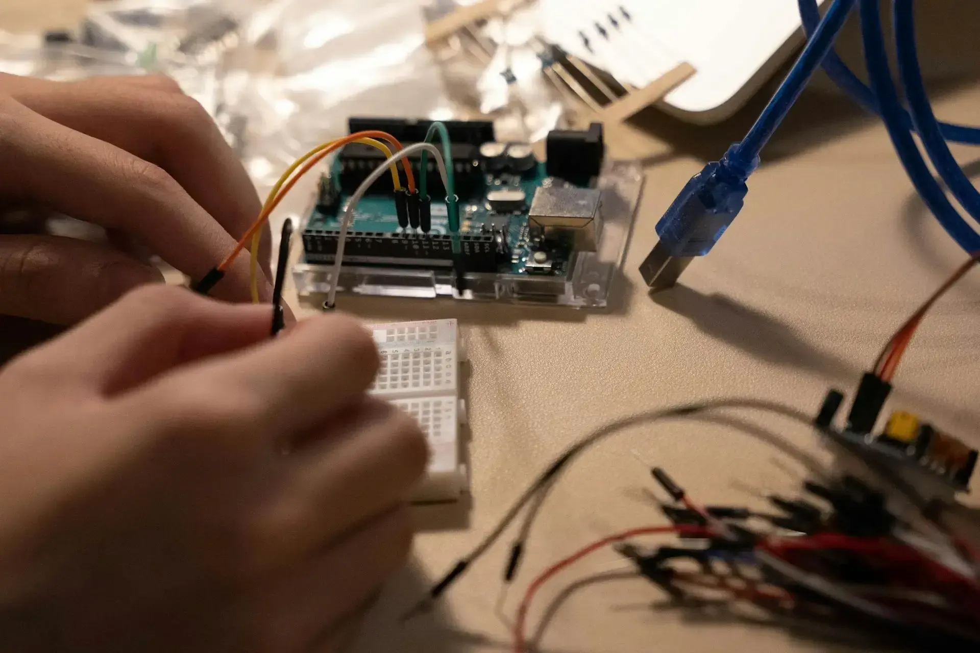 Man wriring a rasberry pi board