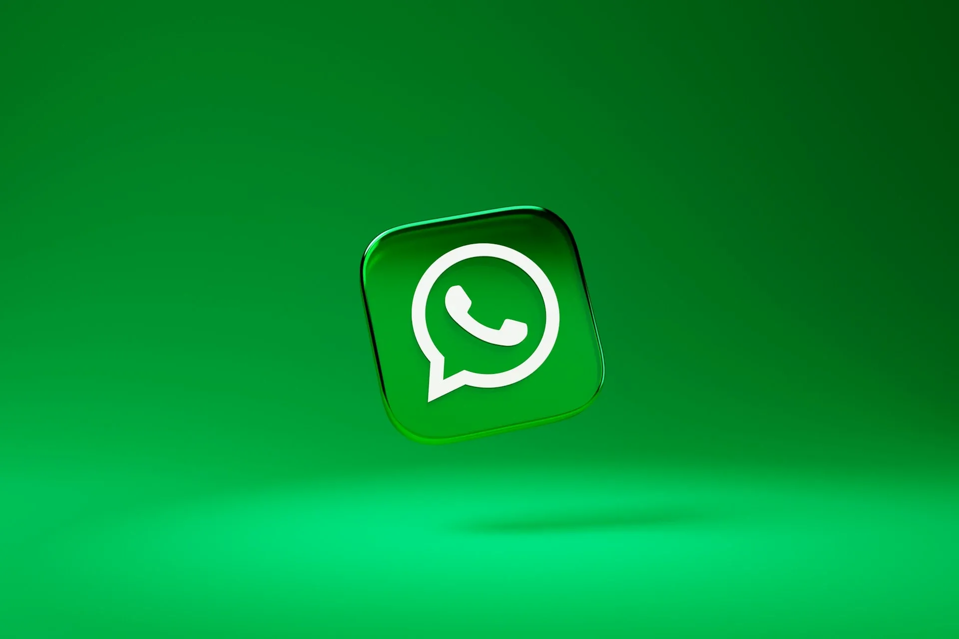 Green square tile with whatsapp logo on it on green background.webp